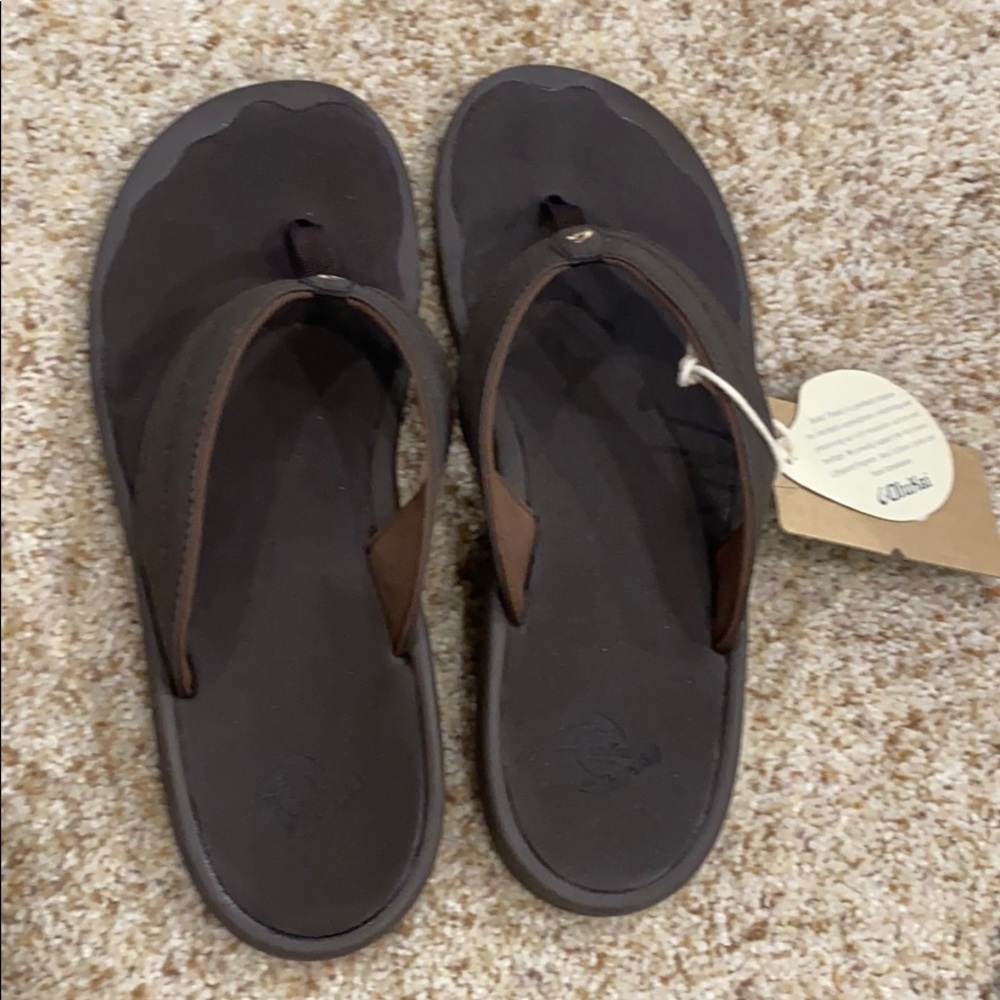 Never worn Olukai Sandals